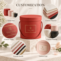 Boîte cadeau cylindrique rigide en carton texturé avec poignée en corde ronde, couvercle et base personnalisés avec logo, pour l'emballage de fleurs