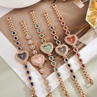 Montre en alliage de quartz exquise et mignonne en forme de cœur, bracelet élégant et luxueux pour femme, orné de diamants, avec aiguille décorative