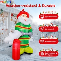 Nouveau Père Noël pompier gonflable, décoration gonflable tenant un extincteur, Père Noël souriant pour la décoration de la cour
