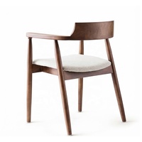 Fauteuil en bois massif de style mid-century, revêtement en cuir, assise rembourrée, accoudoirs incurvés, dossier de soutien, salle à manger, salon, réception