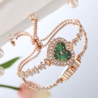 Montre-bracelet à quartz LP26 pour femme, style quotidien, cadran cœur étincelant avec strass, bracelet chaîne en alliage réglable offert