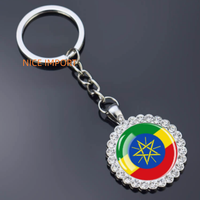 Porte-clés fleur en strass drapeau de Djibouti, très populaire, pour sac à dos, décoration de clés, breloque de portefeuille, souvenir de voyage