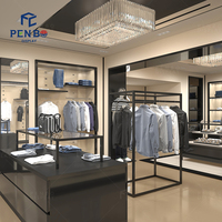 Présentoir de vêtements en métal noir personnalisé avec logo pour magasin de vêtements pour hommes, support de présentation de costumes, présentoir de vêtements de détail