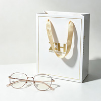 Sac cadeau personnalisé en papier couché blanc, sac de vente au détail recyclable pour magasin d'optique, emballage de boîte à lunettes