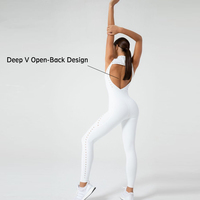 Vêtements de Yoga à la mode blanc creux sculpté conception Non voir à travers combinaison col haut fermeture éclair maigre costume de sport femmes vêtements de sport Onesie