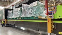 Machine de manutention de conteneurs, système de chargement et de déchargement de conteneurs pour une utilisation efficace, machine de chargement et de déchargement automatique