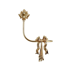 Antique Gold Curved Curtain Holdback with Floral Design and Bow Detail Decorative Window Hardware - Product Image 1