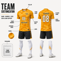 Tenue de football personnalisée camouflage orange, ensemble maillot et short respirant à manches courtes pour l'entraînement quotidien de l'académie de football