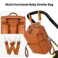 Sac à dos à langer grande capacité en cuir PU imperméable avec station de change intégrée pour maman et papa, idéal pour les voyages et doté de crochets pour poussette