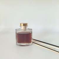Vente directe en gros du fabricant – Vases diffuseurs d'arômes ovales en verre 200 ml et 100 ml, minimalistes, à rayures verticales, avec marquage à chaud