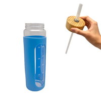 Bouteille d'eau potable en verre de 650ml 1000ml avec manchon en silicone Flacon à thé en verre de grande capacité avec logo personnalisé pour eau chaude