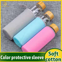 Bouteille d'eau réutilisable en verre borosilicaté transparent avec couvercle en métal doré et logo personnalisé OEM 350ml 500ml 750ml 1L