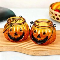Pot à bougie en verre en forme de citrouille avec poignée en métal pour la décoration d'ambiance du festival d'Halloween