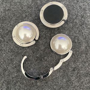 Porte-sac de table rond de luxe en fer plaqué argent avec perles et impression sérigraphiée, design moderne, pour cadeaux féminins - Product Image 1