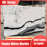 Marbre blanc panda naturel, idéal pour les escaliers de hall d'hôtel de style moderne, les sols et les tables de salle à manger, ainsi que les îlots de cuisine.