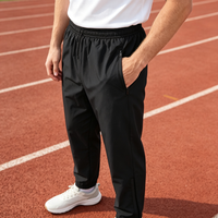 Pantalon de survêtement pour homme en polyester Ripstop avec logo personnalisé OEM, taille élastiquée, cordon de serrage intérieur et doublure en jersey interlock, idéal pour l'entraînement.