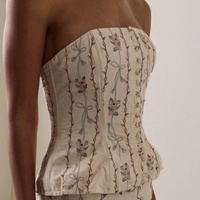 Haut corset bustier sans bretelles en lin crème, broderie florale, fermeture boutonnée sur le devant, structuré avec baleines, style vintage victorien, pour soirée