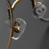 Le fabricant soutient la petite vente en gros de plaquettes de nez en PVC pour lunettes, accessoires de chaîne de lunettes, plaquettes de nez verrouillables en plastique pour lunettes