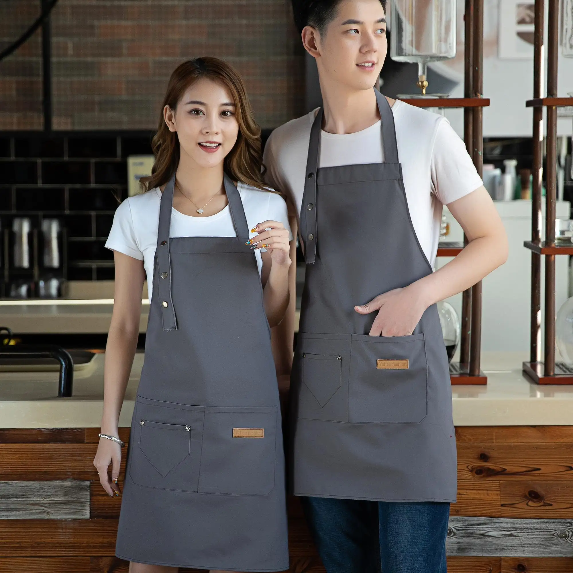 Tabliers de chef de cuisine avec deux poches logo personnalisé imprimé noir promotion imperméable polyester 100% coton biologique toile