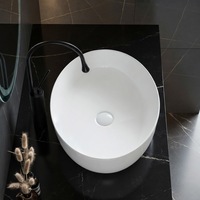 Vasque ovale en céramique de style minimaliste, à poser sur comptoir, pour salle de bain d'hôtel
