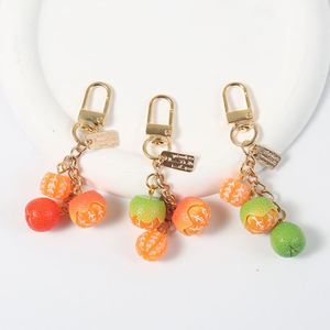 Accessoires de pendentif porte-clés en résine, motif fruit de mandarine, style dessin animé pastoral, mignons et simples, pour sacs d'école, téléphones et écouteurs - Product Image 3