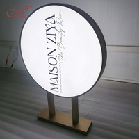 Boîte d'éclairage à LED en acrylique double face personnalisée cadre circulaire en métal pour la publicité commerciale extérieure populaire dans les magasins
