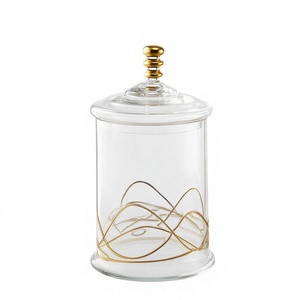 Frasco de Vidrio Transparente con Detalles Metálicos, Contenedor de Almacenamiento de Vidrio Sofisticado con Tapa Plateada y Detalles Dorados - Product Image 1