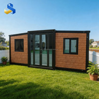 Maison conteneur moderne extensible et respirante de 20 pieds avec porte coulissante en bois naturel et cuisine pour studio de jardin