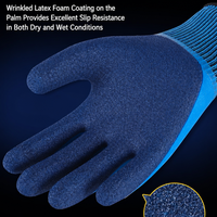 Gants en latex bleu de longueur poignet avec revers en tricot côtelé élastique, paume enduite imperméable et antidérapante pour usage industriel