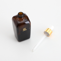 Vente en gros de flacons compte-gouttes carrés en verre couleur ambre 10/25/30/50/100 ml pour l'emballage des soins de la peau