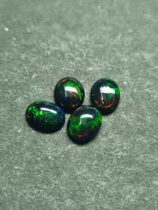 Opale noire d'Éthiopie naturelle, cabochon 10x12 mm, pierre précieuse en vrac |   Pierre d'opale noire ovale pour la fabrication de bijoux |   Fournisseur en gros - Product Image 6
