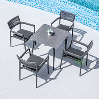 (E3086) vente en gros, chaise de salle à manger empilable en corde noire tissée pour salon de jardin extérieur