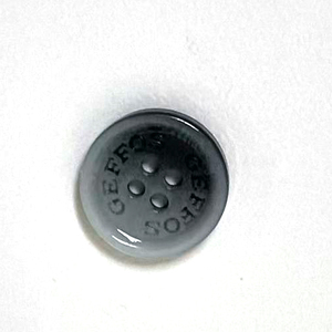 Nút áo nhựa hỗn hợp màu đen và trắng tùy chỉnh, thích hợp để may trên áo sơ mi nam và nữ, có bốn lỗ. - Product Image 1