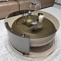 Table basse en verre élégante et contemporaine avec base arrondie unique Meubles de maison pour espaces de vie modernes et décoratifs