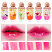 Brillant à lèvres minéral à la mode de marque privée hydratation durable rouge à lèvres liquide repulpant glaçure à lèvres à changement de fleur populaire