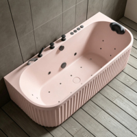 Baignoire en pierre artificielle rose avec surface à motif marbré, baignoire autoportante de spa avec massage