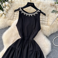Nouvelle Robe d'Été Élégante sans Manches Col Rond Perles Noire Coupe Évasée