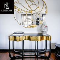Console de meubles de salon à armature en métal noir et or durable en acier inoxydable au design de luxe