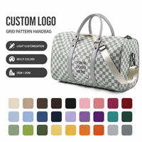 Sac de sport et de voyage en cuir durable grande capacité avec compartiment sec/humide et fermeture éclair tendance
