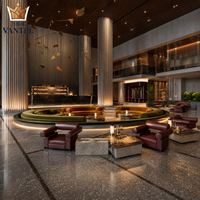 Ensemble de mobilier de luxe pour hall d'hôtel : canapé incurvé, fauteuils lounge, tables basses en pierre et console pour projets hôteliers