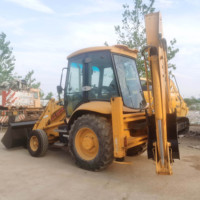 Chargeuse-pelleteuse d'occasion de 7,6 tonnes en stock avec godet frontal et bras d'excavation arrière pour une expédition rapide à l'exportation