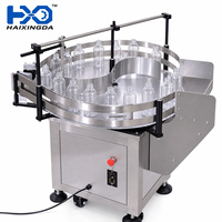 Machine d'alimentation rotative semi-automatique pour bouteilles, plateau tournant pour le débouclage et le tri des bouteilles en plastique pour l'emballage de bouteilles de shampoing