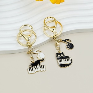 Llavero colgante de aleación con diseño de gato y nota musical de piano, estilo literario, para bolso - Product Image 4