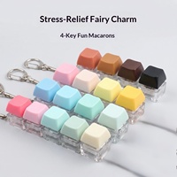 Jouet anti-stress en plastique, couleur unie, macaron, clavier linéaire à quatre touches, porte-clés carré, petit pendentif