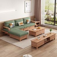 Canapé d'angle scandinave en forme de L avec base en bois de frêne massif et coussins en mousse haute densité pour appartements compacts