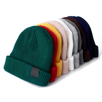 Bonnet acrylique avec écusson en cuir personnalisé et logo bonnet tête de mort chaud d'hiver tricoté unisexe bonnet de couleur unie