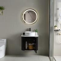 Meuble-lavabo flottant moderne noir mat cannelé avec vasque à poser et miroir rond rétroéclairé par LED pour appartement