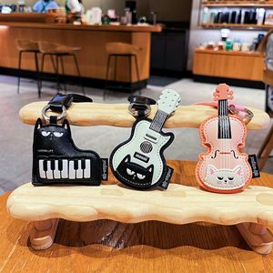 Nouveau Porte-clés en Cuir 2026 avec <span class=keywords><strong>Guitare</strong></span> et Chat, Breloque Piano, Pendentif de Sac Créatif et Adorable pour Filles - Vente en Gros - Product Image 1