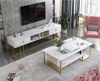 Table basse moderne à double niveau avec pieds dorés et plateau en marbre pour le salon