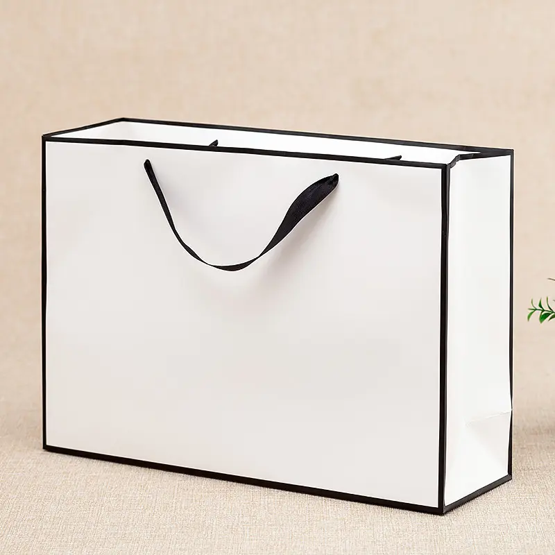 Sacchetto di carta dal design personalizzato con manico a nastro sacchetto di carta per gioielli imballaggio con sacchetto di carta lavabile con papillon
